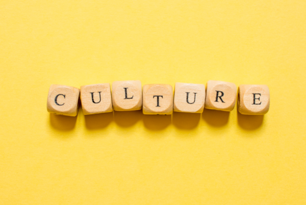 Individual blocks with letters spell out the word "Culture" in a single row against a yellow background.